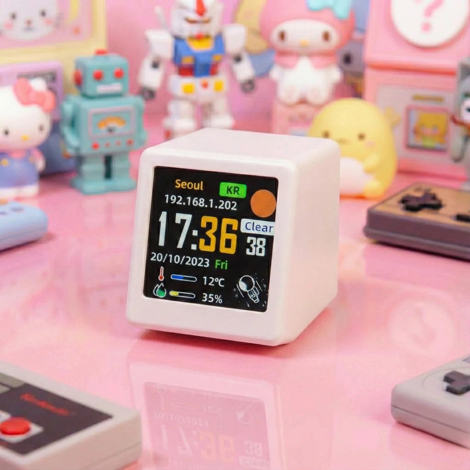 Digital clock with display on a pink surface with toys in the background