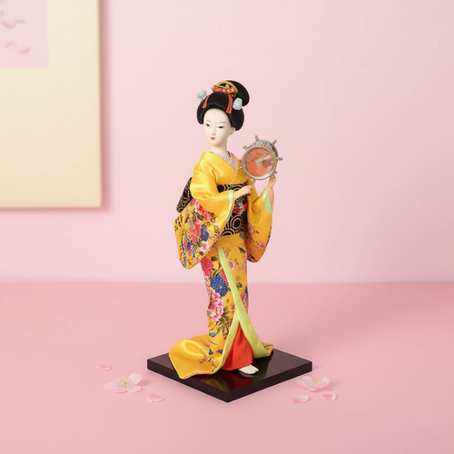 Traditional Japanese doll in a yellow kimono with a pink background