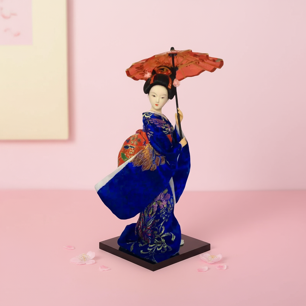 Traditional Japanese doll in a blue kimono with an umbrella on a pink background