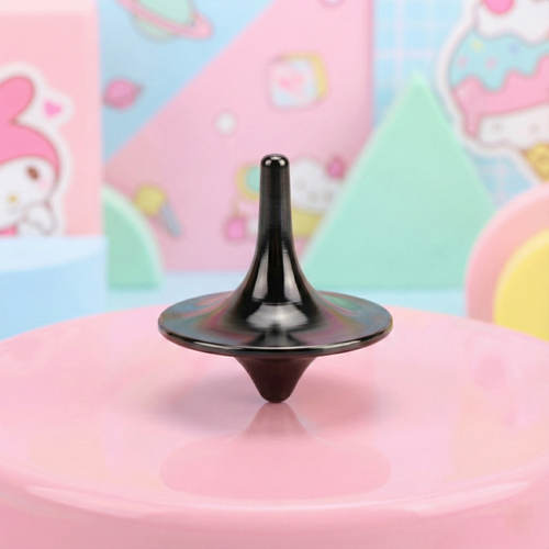 Black spinnable object on a pink surface with colorful background
